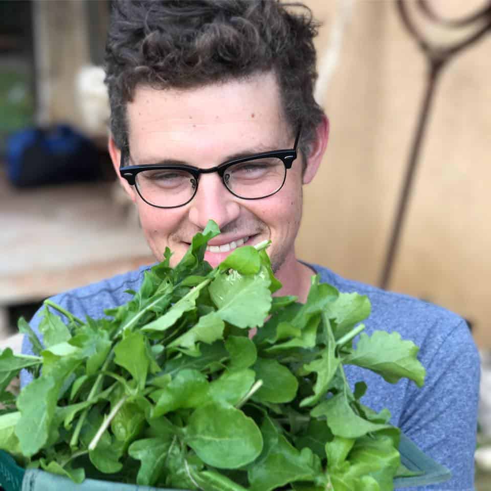 Executive Chef Andy Doubrava holding herbs