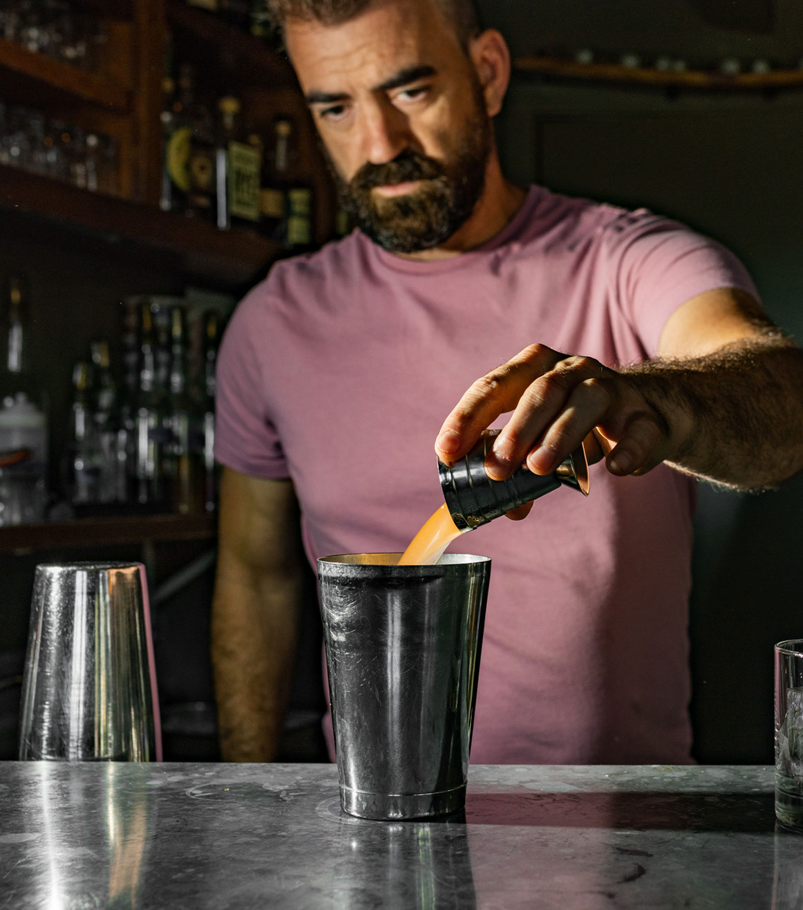 Bar Manager Justin Dicken making a cocktail